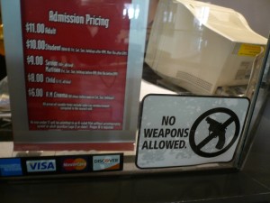 AMC Theatres: No Weapons Allowed AMC Theatres: No Weapons Allowed, Courtesy of gruntzooki via Flickr
